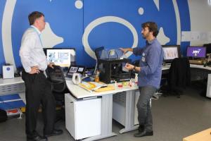 Michael Grima (right) discusses fast-track prototyping in the new design lab with Phillip Higgins of VIP Packaging during the AIP site visit to the Food Innovation Centre at Mondelez International's Ringwood, Victoria facility.